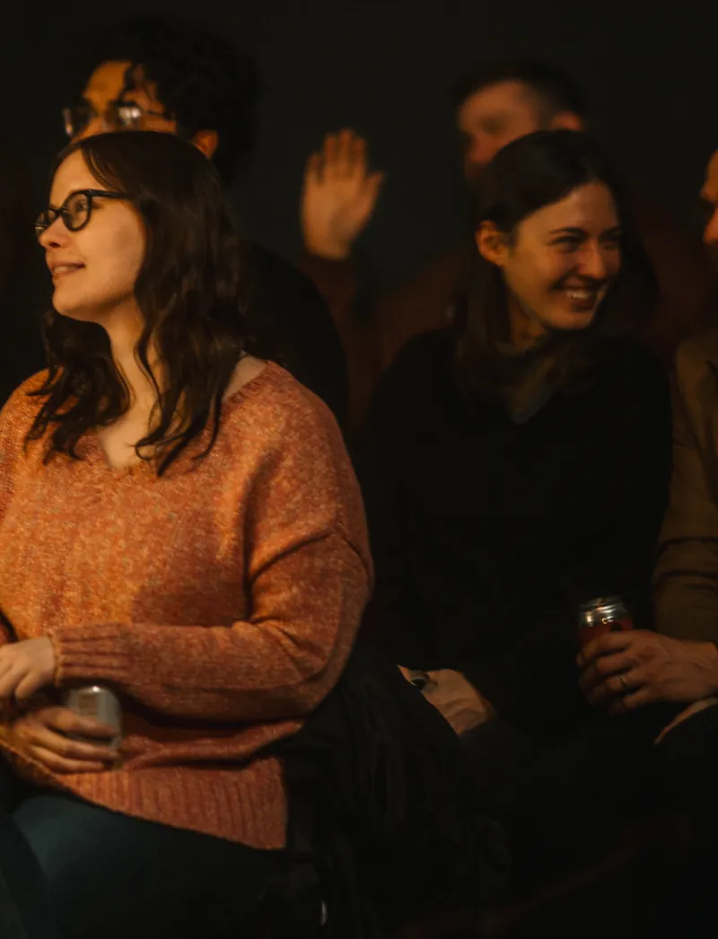 Audience laughing at an Evan Lopez comedy show